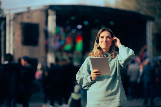 Stressed Music Festival Organizer Holding a Pc Tablet. Unhappy public relation specialist unable to make arrangements 
