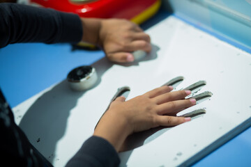 Children's hands doing science experiments