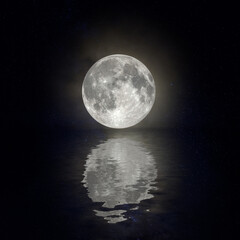 A full moon reflected in the water