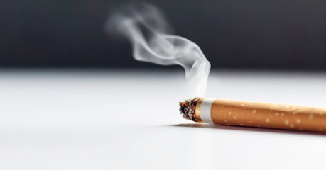 Smoking cigarette, cigarette burning and tobacco smoke, light background. copy space. World no tobacco day.