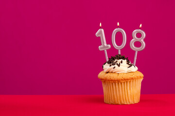 Birthday cake with candle number 108 - Rhodamine Red foamy background