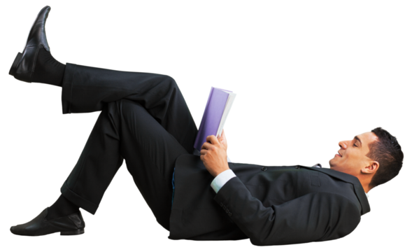 A young happy businessman reading book