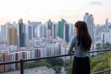 Fototapeta na wymiar Woman enjoy the city view in Hong Kong