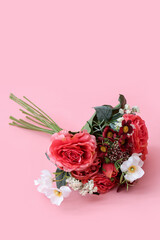 Bouquet of beautiful flowers on pink background