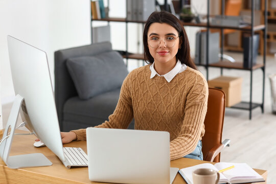 Young female programmer working in office