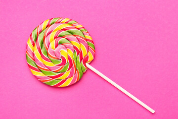 Colorful lollipop on pink background