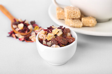 Bowl with dried fruit tea and snacks isolated on white background
