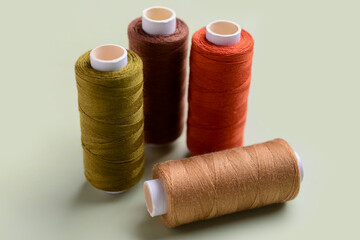 Set of sewing threads on light background