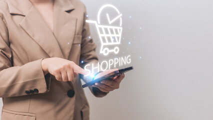 Woman using smartphone with shopping cart icon and online shopping concept on screen