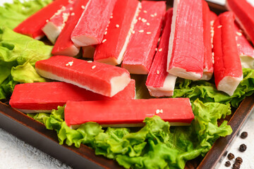 Plate with tasty crab sticks on table, closeup © Pixel-Shot