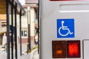 Wheelchair symbol, handicapped, physically challenged and disabled on the shutter bus.