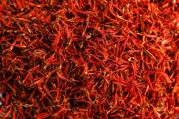 Fototapeta premium Pile of saffron as background, closeup