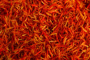 Fototapeta premium Pile of saffron as background, closeup