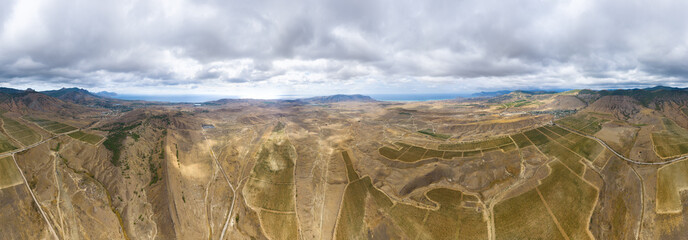 Sudak, Crimea. Vineyards near the village of Solnechnaya Dolina. Autumn. Panorama 360. Aerial view