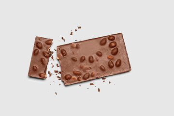 Sweet tasty chocolate with nuts on  light background