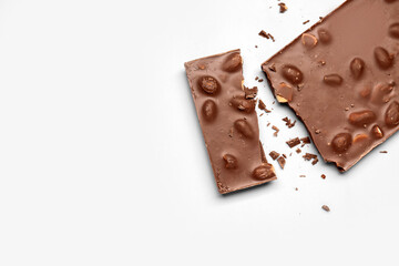 Sweet tasty chocolate with nuts on  light background