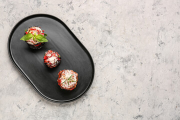 Tray with tasty baked Eggplant Parmesan on grunge background