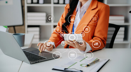  Businesswoman working with smart phone and laptop and digital tablet computer in office with digital marketing media in virtual icon