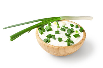 Bowl of tasty sour cream with green onion on white background