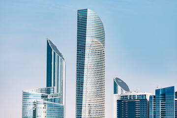 Marvel at the breathtaking beauty of Abu Dhabi's towering buildings, which stretch high into the...