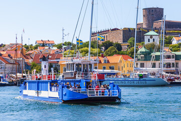 Fototapeta na wymiar Tourist on the ferry to Marstrand island in Sweden