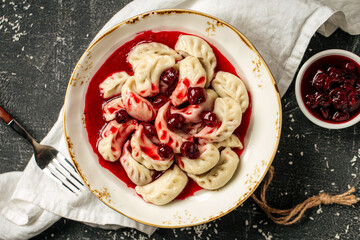 Obraz na płótnie Canvas Portion of russian dumplings vareniki with cherry filling