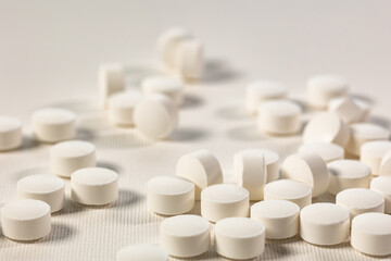 Pharmacy theme, white medicine tablets antibiotic pills. Concept of healthcare and medicine.