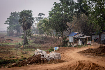 U Shaped dirt road of a rural village. Summer Landscape. Rural India. Bankura West Bengal India South Asia Pacific