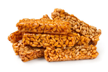 Sweet kozinaki from sunflower seeds. Kozinaki on a white background. Confectionery close-up.