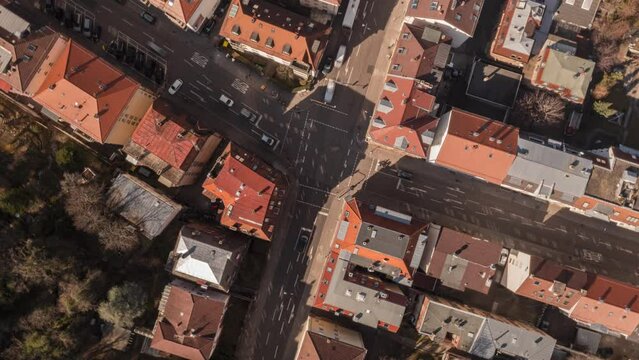 Time lapse aerial view cars speeding through sunny urban intersection, Stuttgart, Germany

