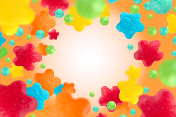 Sugar sprinkles on orange background, copy space.