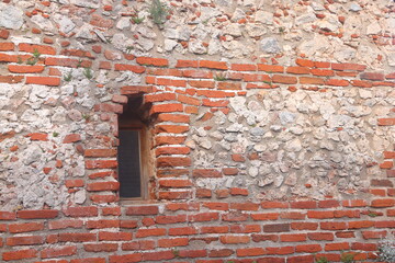 Old brick wall with a window, old masonry, remake.