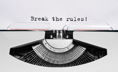 Text Break the rules typed on retro typewriter