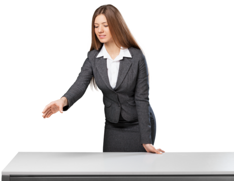 Beautiful young businesswoman standing against table top