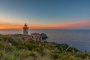 Fototapeta na wymiar The Capo Zafferano lighthouse at dusk, province of Palermo IT