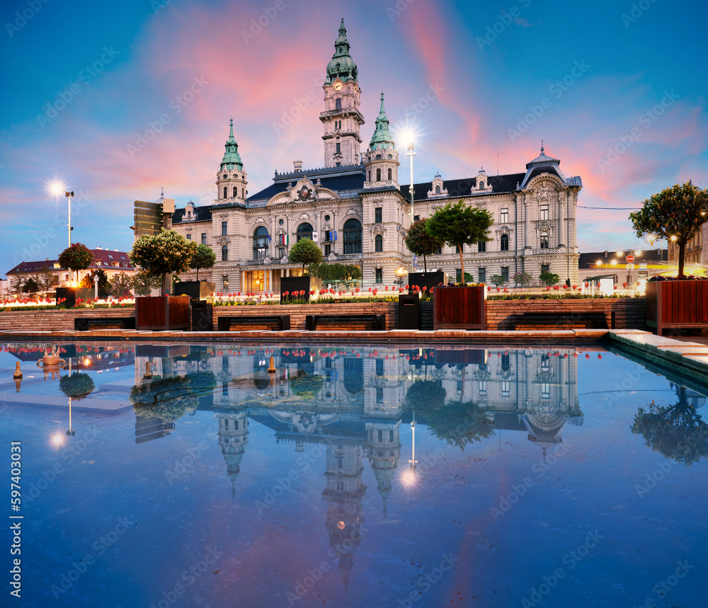 Canvas Prints Gyor Town hall at night with reflection in water, Hungary