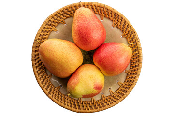 Four organic pears in ceramic plate isolated on white background, top view, macro.