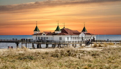 sunset over the baltic sea in ahlbeck with house - obrazy, fototapety, plakaty