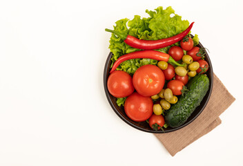 Vegetables and salad in a plate.