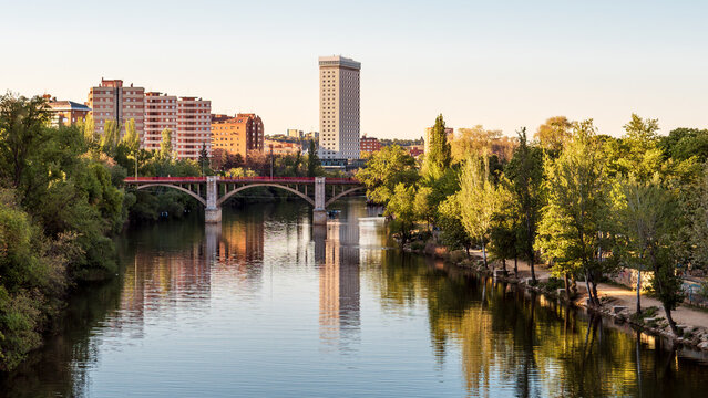Urban landscape of the city of Valladolid in spring. River Pisuerga's waterfront as it flows through the capital of Valladolid.