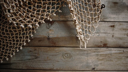 rustic net on wooden plank