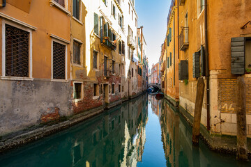 Narrow canals of Venice city with old traditional architecture, bridges and boats, Veneto, Italy. Tourism concept. Architecture and landmark of Venice. Cozy cityscape of Venice.