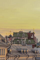 roofs of city houses at sunset