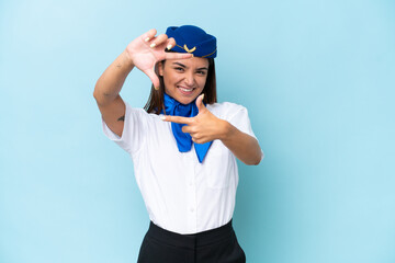 Airplane stewardess caucasian woman isolated on blue background focusing face. Framing symbol