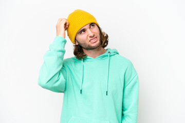 Young handsome man isolated on white chroma background having doubts and with confuse face expression
