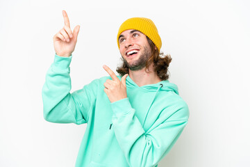 Young handsome man isolated on white chroma background pointing with the index finger a great idea
