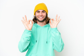 Young handsome man isolated on white chroma background in zen pose