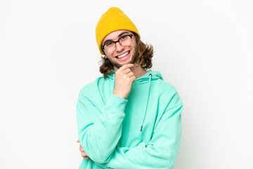 Young handsome man isolated on white chroma background with glasses and smiling