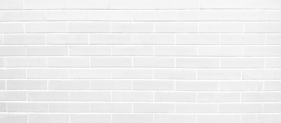 Brick wall painted with gray paint pastel bright tone texture background. Brickwork and stonework flooring interior with rock old pattern clean grid concrete uneven bricks design backdrop.