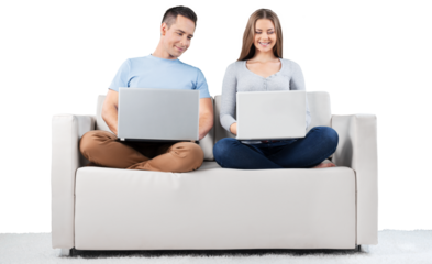 Smiling Couple Using Laptop on the Couch